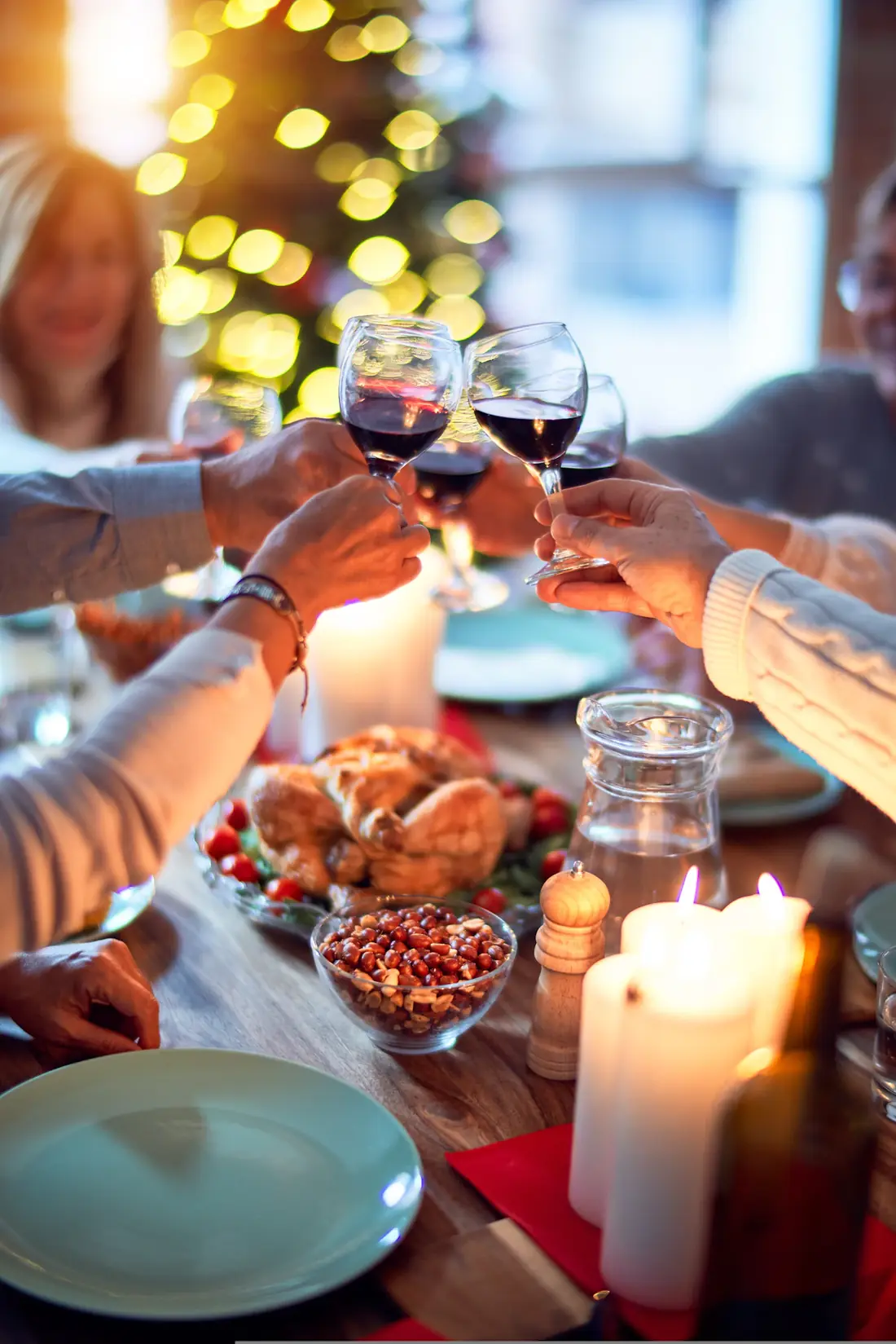 A family raising glasses over a Thanksgiving dinner